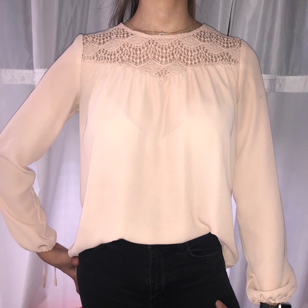 Long sleeved blouse with front and back detail